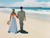 Couple on the beach on their wedding day