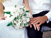 Bride and groom with white flowers