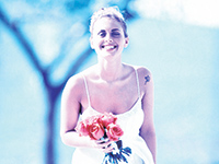 Bride with red flowers with blue tinge